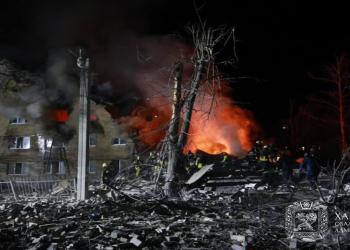 At least 11 dead as Russia fires ballistic missile at a high-rise building in Kharkiv